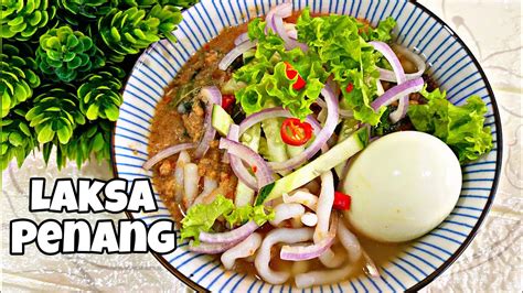  Laksa Penang: Niebiańskie połączenie pikantnego bulionu i kremowych makaronów!